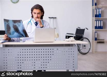 The young male doctor radiologist working in the clinic . Young male doctor radiologist working in the clinic