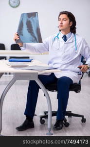 The young male doctor radiologist working in the clinic. Young male doctor radiologist working in the clinic