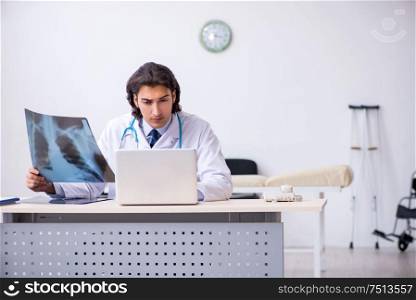 The young male doctor radiologist working in the clinic. Young male doctor radiologist working in the clinic