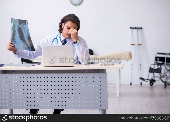 The young male doctor radiologist working in the clinic. Young male doctor radiologist working in the clinic