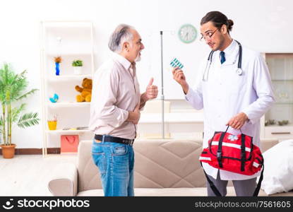 The young male doctor visiting old patient at home. Young male doctor visiting old patient at home