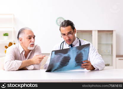 The young male doctor visiting old patient at home. Young male doctor visiting old patient at home