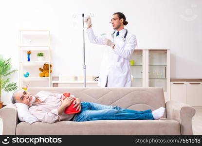 The young male doctor visiting old patient at home. Young male doctor visiting old patient at home