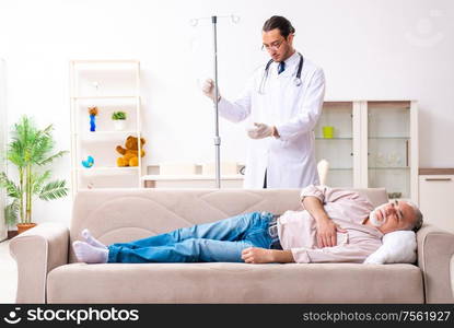 The young male doctor visiting old patient at home. Young male doctor visiting old patient at home