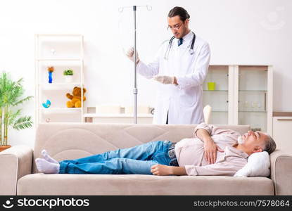 The young male doctor visiting old patient at home. Young male doctor visiting old patient at home