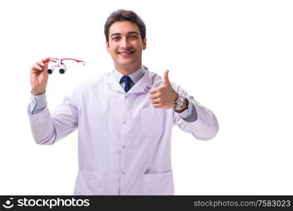 The young male doctor with magnifying glasses isolated on white. Young male doctor with magnifying glasses isolated on white