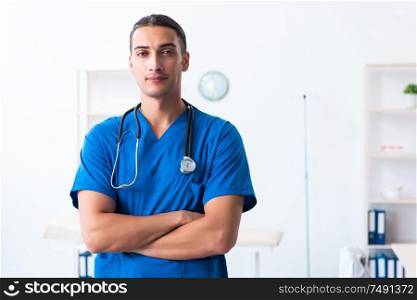 The young male doctor working in the clinic. Young male doctor working in the clinic