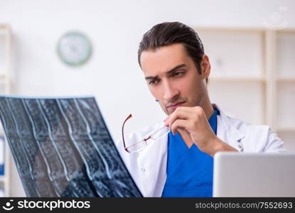 The young male doctor working in the clinic. Young male doctor working in the clinic