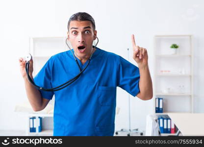 The young male doctor working in the clinic. Young male doctor working in the clinic