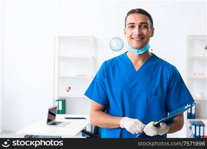 The young male doctor working in the clinic. Young male doctor working in the clinic