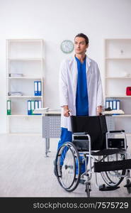 The young male doctor working in the clinic. Young male doctor working in the clinic