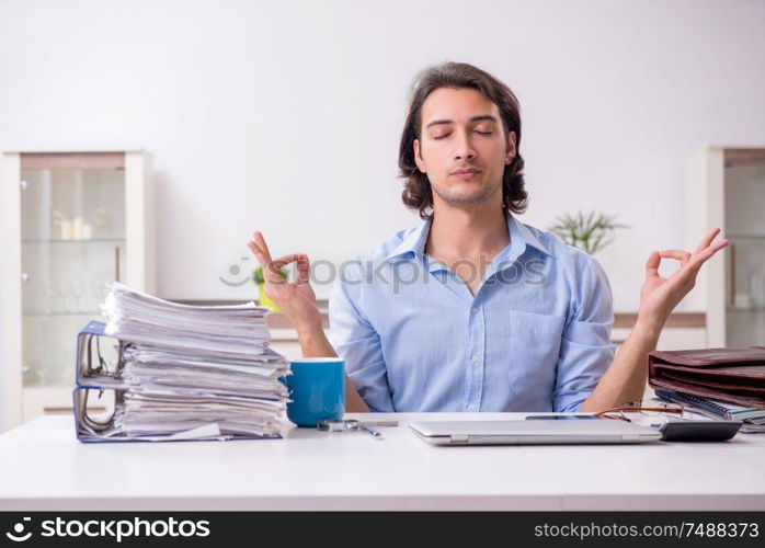 The young male employee working at home. Young male employee working at home