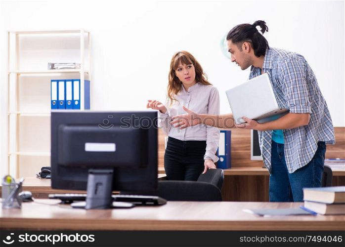 The young male it specialist in the office. Young male it specialist in the office