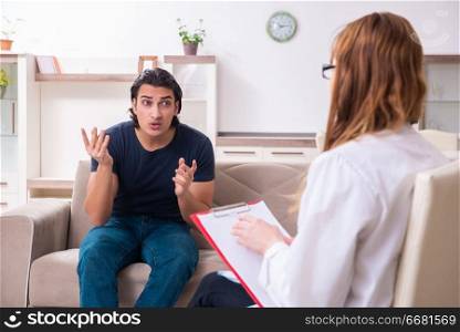 The young male patient discussing with female psychologist personal . Young male patient discussing with female psychologist personal 