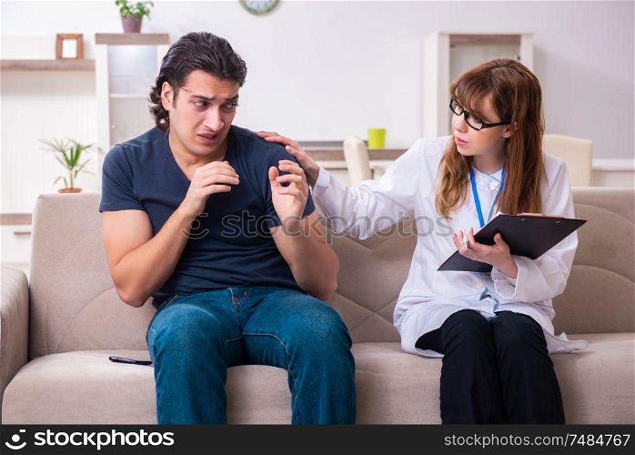 The young male patient discussing with female psychologist personal . Young male patient discussing with female psychologist personal