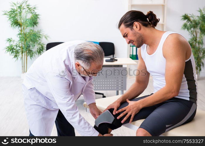 The young male patient visiting experienced doctor. Young male patient visiting experienced doctor