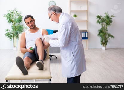 The young male patient visiting experienced doctor. Young male patient visiting experienced doctor