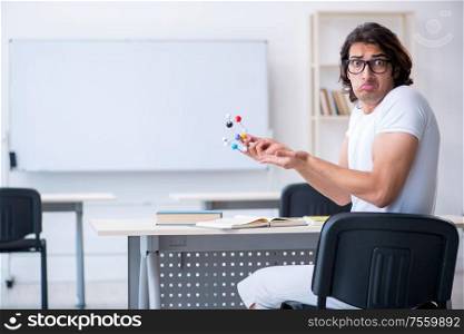 The young male student in front of whiteboard. Young male student in front of whiteboard