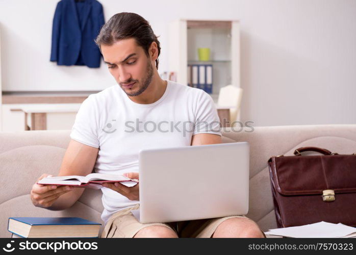 The young male student preparing for exams at home. Young male student preparing for exams at home