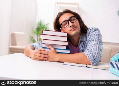 The young male student preparing for exams during christmas. Young male student preparing for exams during Christmas