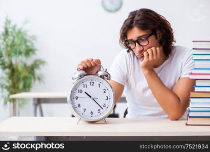 The young male student sitting in the classroom. Young male student sitting in the classroom