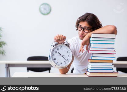 The young male student sitting in the classroom. Young male student sitting in the classroom