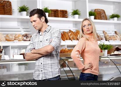The young man and the girl have quarrelled in shop