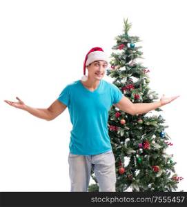 The young man decorating christmas tree isolated on white. Young man decorating christmas tree isolated on white