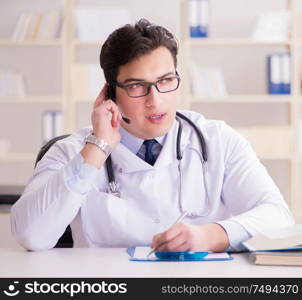 The young man doctor in medical concept. Young man doctor in medical concept