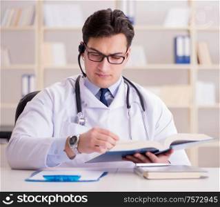 The young man doctor in medical concept. Young man doctor in medical concept