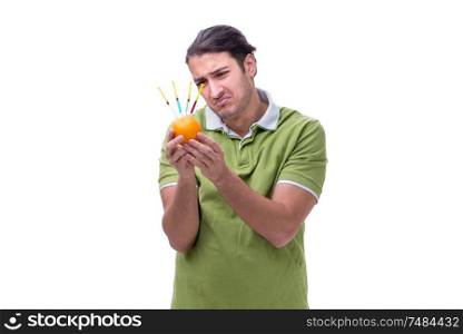 The young man in gmo fruits and vegetables concept. Young man in GMO fruits and vegetables concept