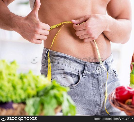 The young man in healthy eating and dieting concept. Young man in healthy eating and dieting concept