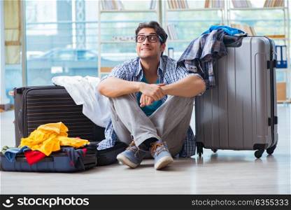 The young man preparing for vacation travel. Young man preparing for vacation travel