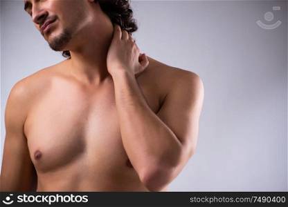 The young man suffering from neck pain. Young man suffering from neck pain
