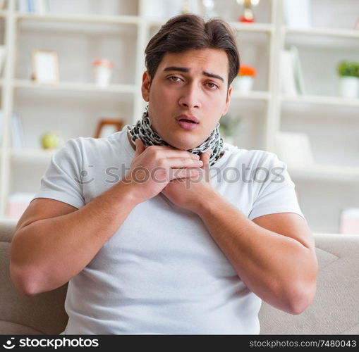 The young man suffering from sore throat. Young man suffering from sore throat