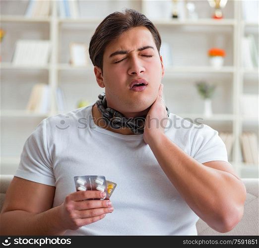 The young man suffering from sore throat. Young man suffering from sore throat