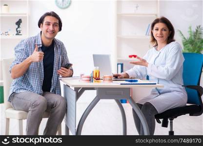 The young man visiting female doctor stomatologist. Young man visiting female doctor stomatologist