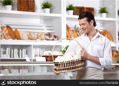The young man with a basket of cakes