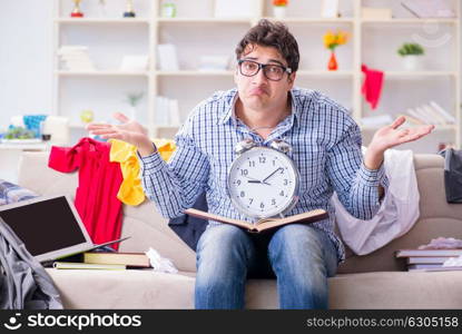 The young man working studying in messy room. Young man working studying in messy room