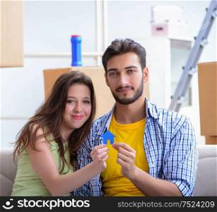 The young pair moving in to new apartment under mortgage. Young pair moving in to new apartment under mortgage