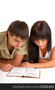 The young pair reads the book on a white background