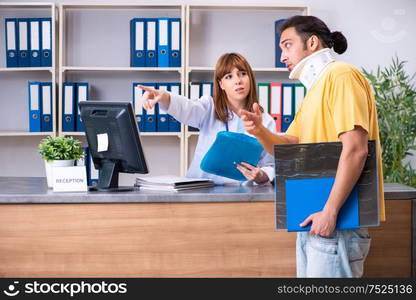 The young patient at the reception in the hospital. Young patient at the reception in the hospital