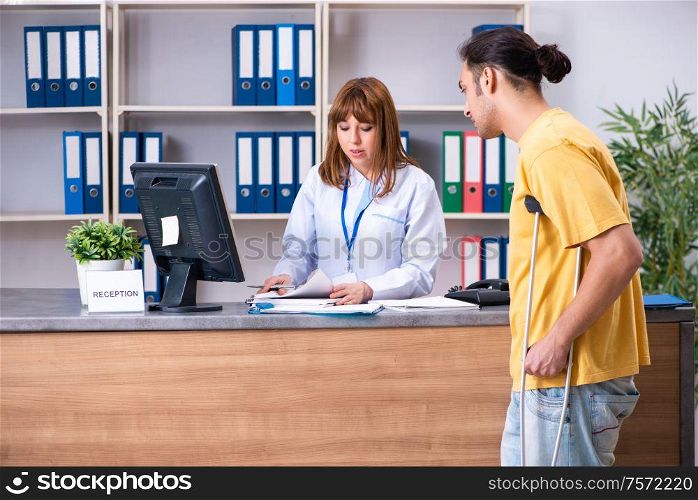 The young patient at the reception in the hospital. Young patient at the reception in the hospital