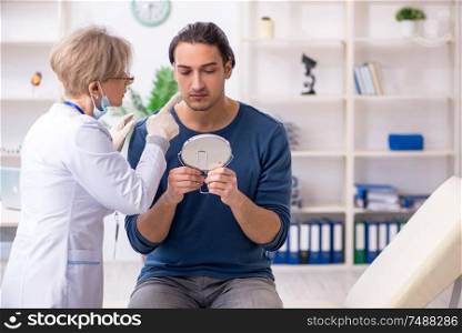 The young patient visiting doctor in hospital. Young patient visiting doctor in hospital