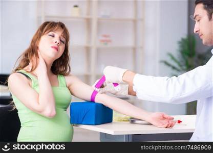 The young pregnant woman in blood transfusion concept. Young pregnant woman in blood transfusion concept