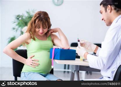 The young pregnant woman in blood transfusion concept. Young pregnant woman in blood transfusion concept