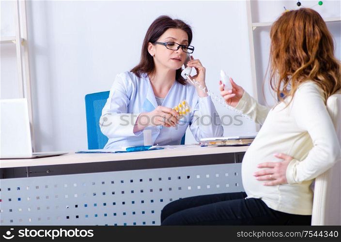 The young pregnant woman visiting experienced doctor gynecologist. Young pregnant woman visiting experienced doctor gynecologist
