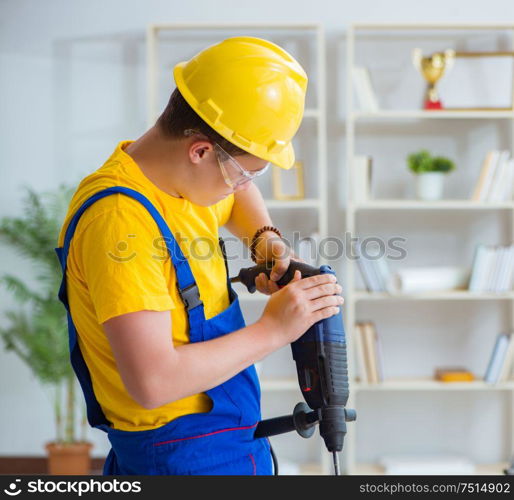 The young repairman with power drill. Young repairman with power drill