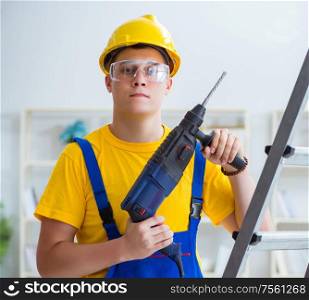 The young repairman with power drill. Young repairman with power drill