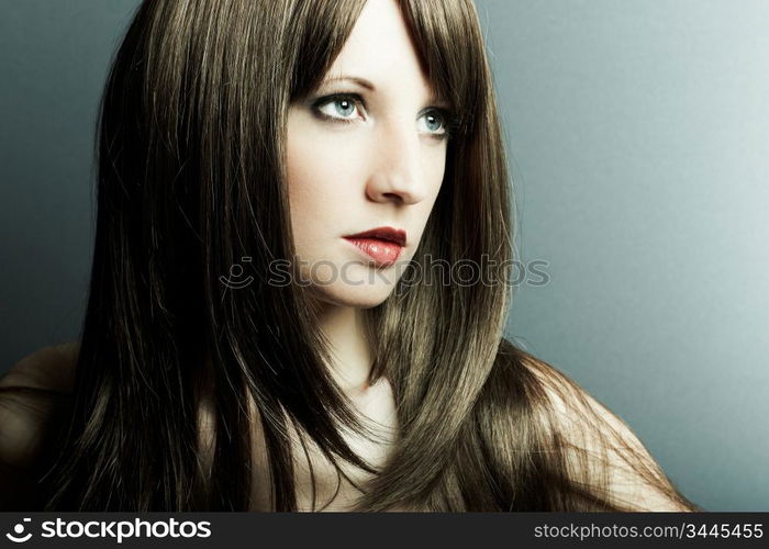 The young sexy girl in chestnut-coloured wig